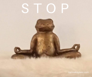 frog statue meditating on a soft blanket